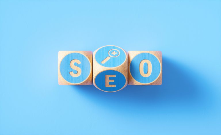 “SEO” Written Blue Wood Blocks Sitting over Blue Background