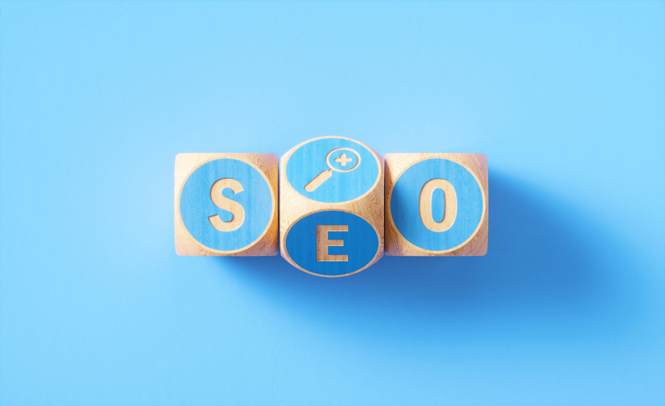 “SEO” Written Blue Wood Blocks Sitting over Blue Background