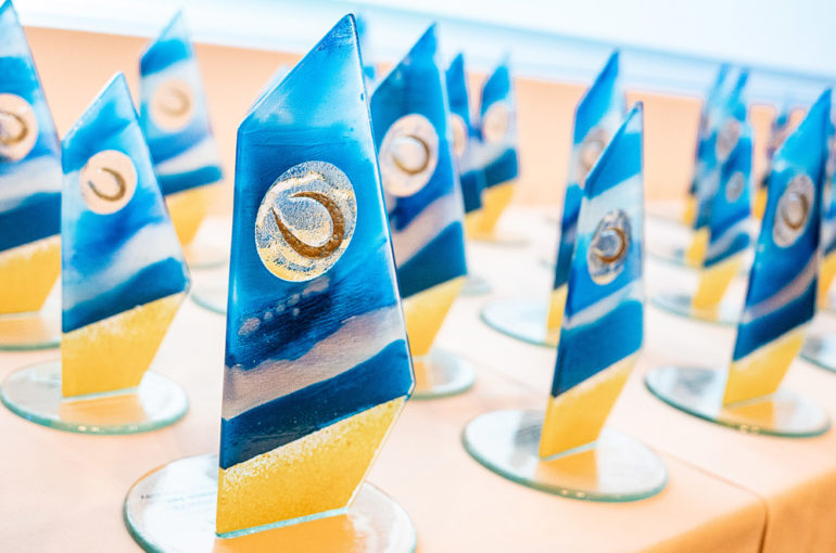 Sail designed glass trophies with CTA logo