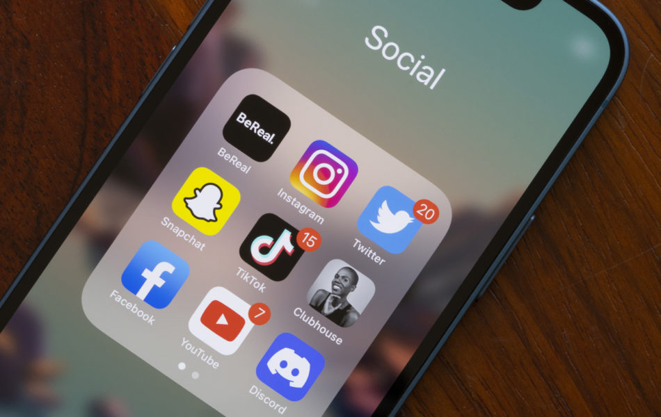 A phone's screen showing the icons for different social media apps.