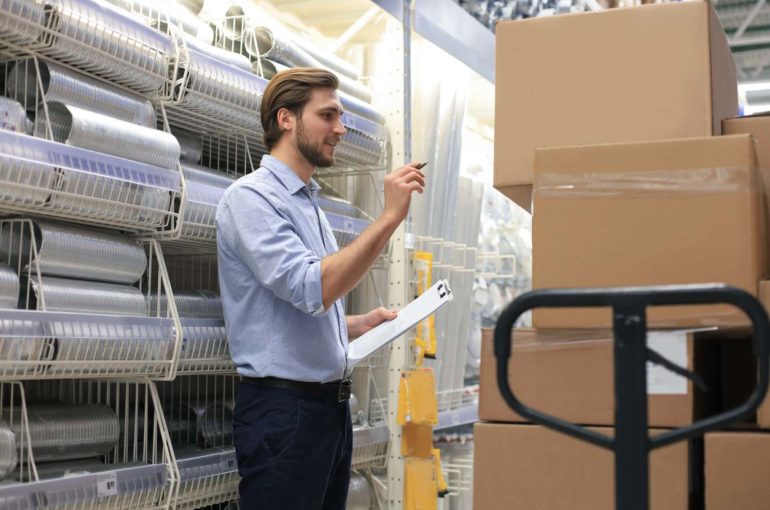 Manager use his tablet for online checking products available.